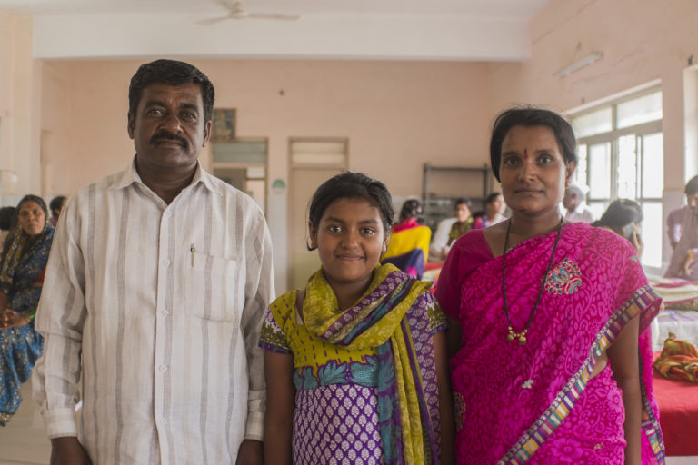 girl and her mom and dad