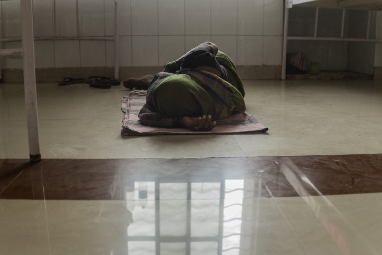 woman sleeping on the floor